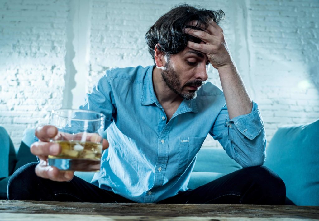 man struggling with chronic disease of alcoholism
