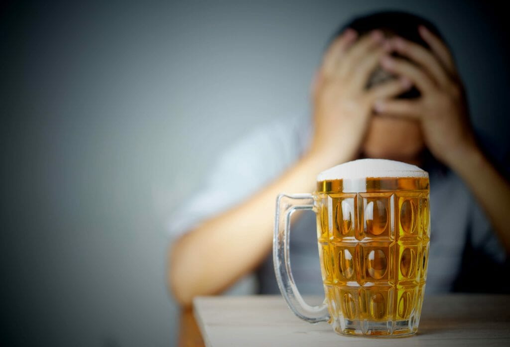 man going through alcohol withdrawal after quitting