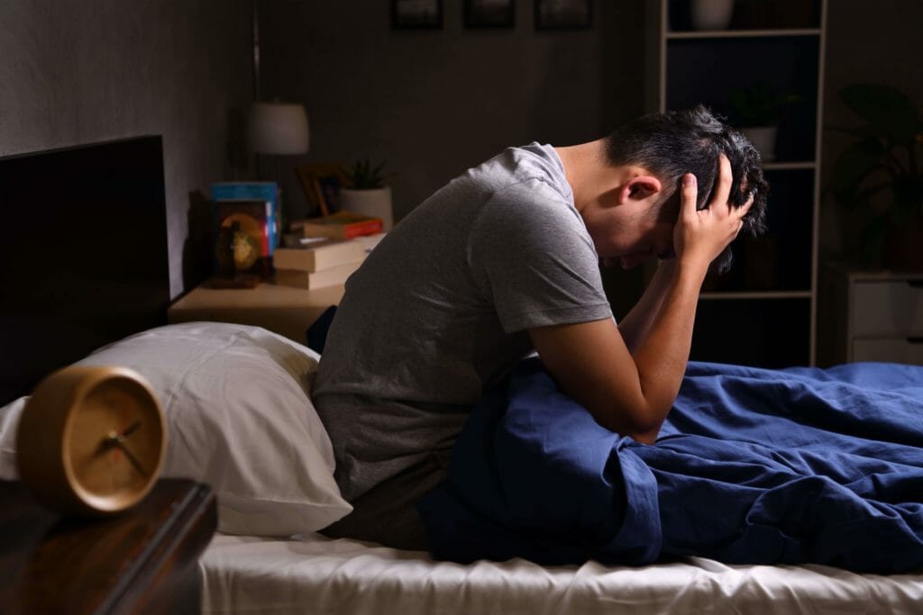 depressed man suffering from insomnia after quitting marijuana