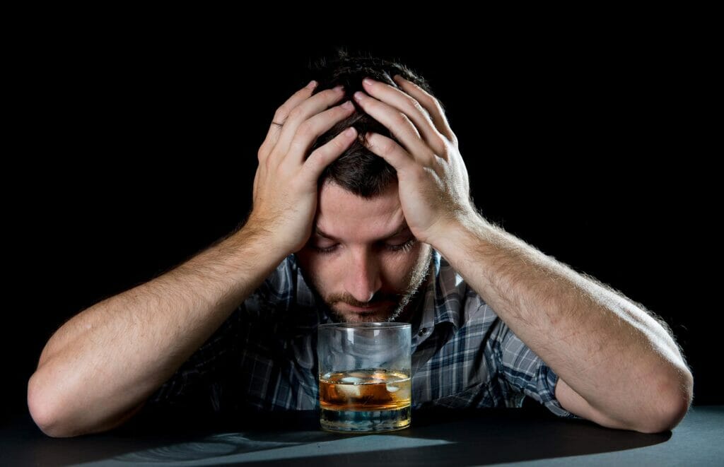 depressed man craving alcohol