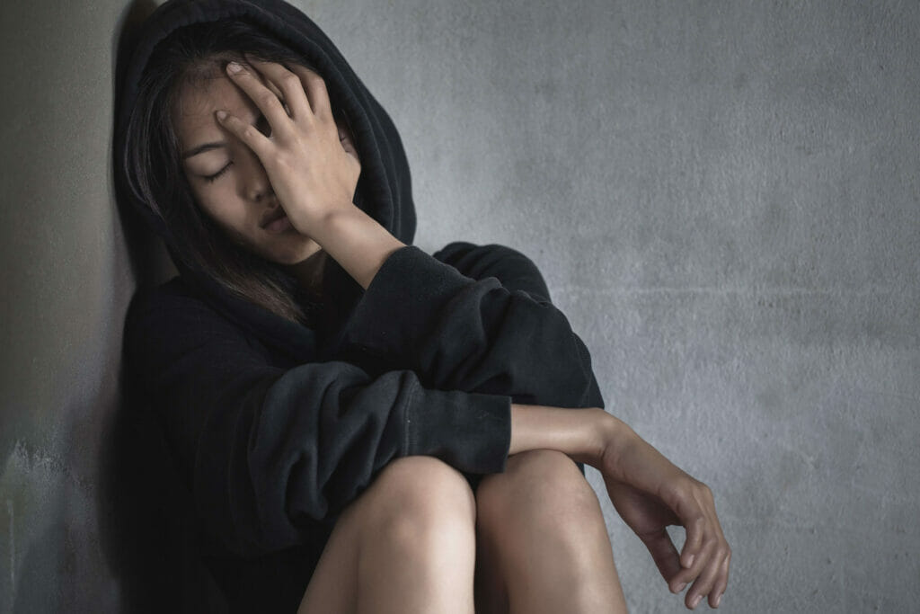 depressed woman going through benzodiazepine withdrawal