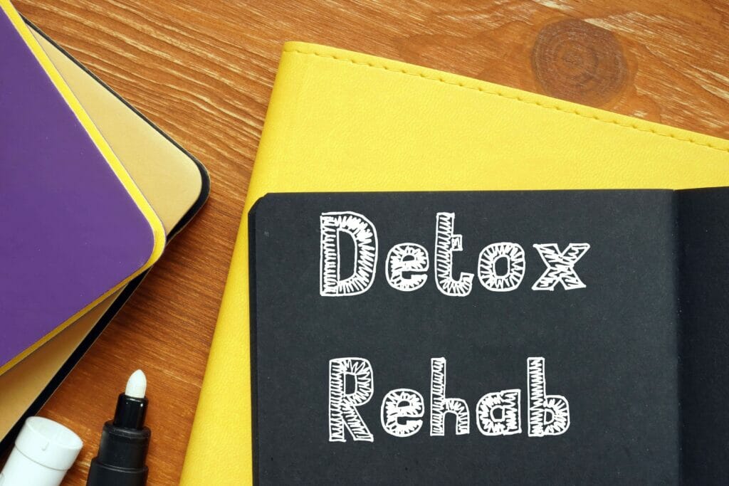detox and rehab outlined on a pad