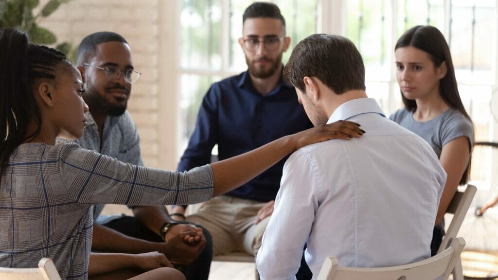 man accepting his addiction in support group